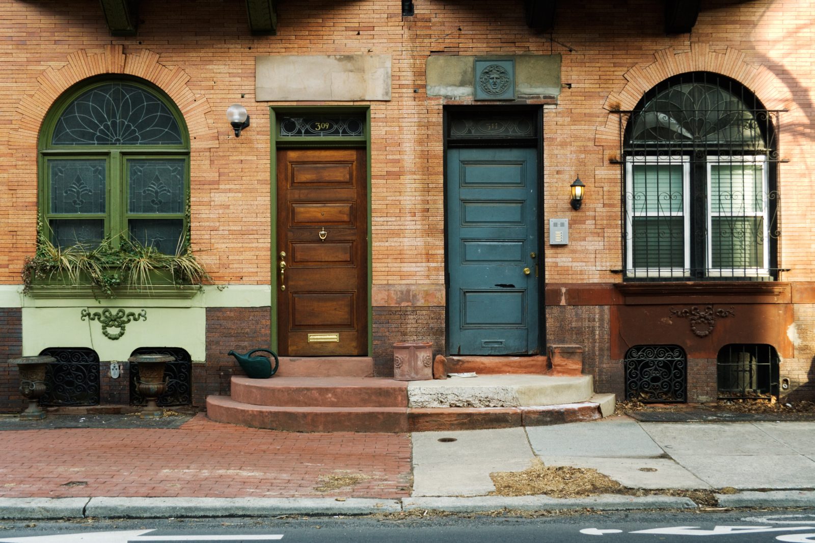 A brown and blue door contrasting each other